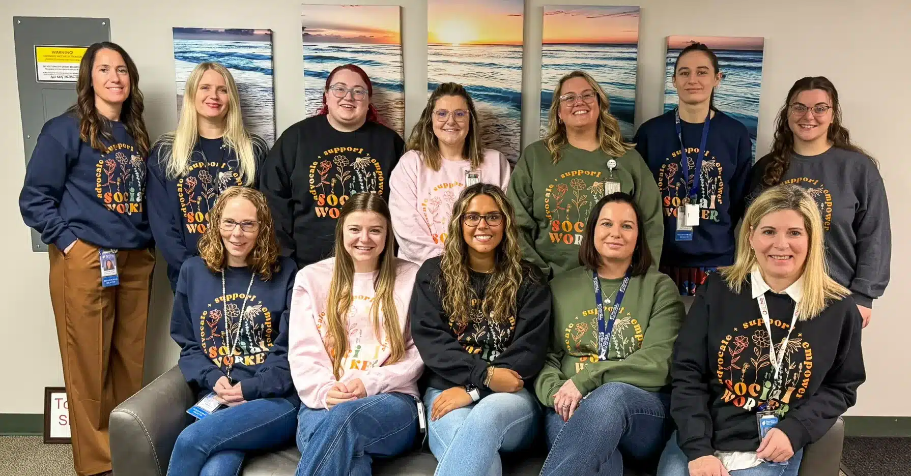 bh_team_2026-2 BH team 2026 on a couch with their social work sweatshirts